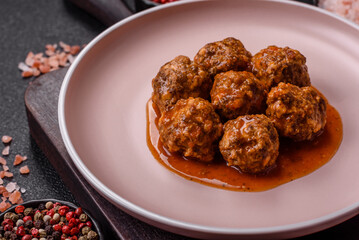 Meat, meatballs in tomato sauce, Italian food, beef or pork with salt . Meatballs with tomatoes