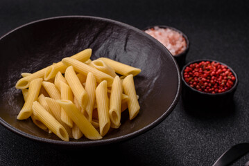 Penne pasta cooked with cheese, salt and spices. Italian food penne pasta