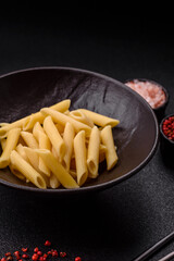 Penne pasta cooked with cheese, salt and spices. Italian food penne pasta