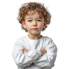 Cute young child with curly hair and a serious expression standing with arms crossed against a white background