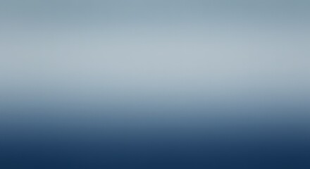 Obraz premium A blurred gradient image transitioning from a light gray-blue at the top to a dark blue at the bottom