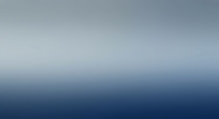 Obraz premium The image features a gradient background, transitioning from light gray at the top to dark blue at the bottom. The transition is smooth and blurred.