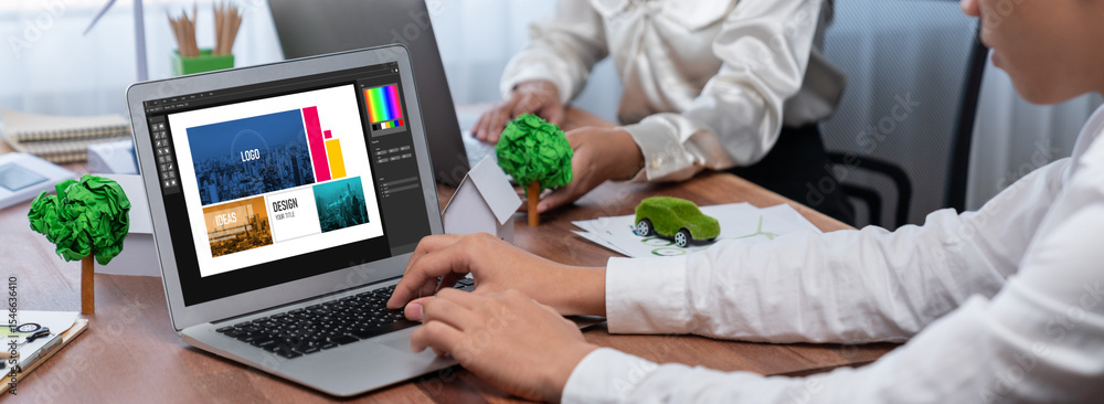 Poster graphic designer software for modern design of web page and commercial brisk ads showing on the comp