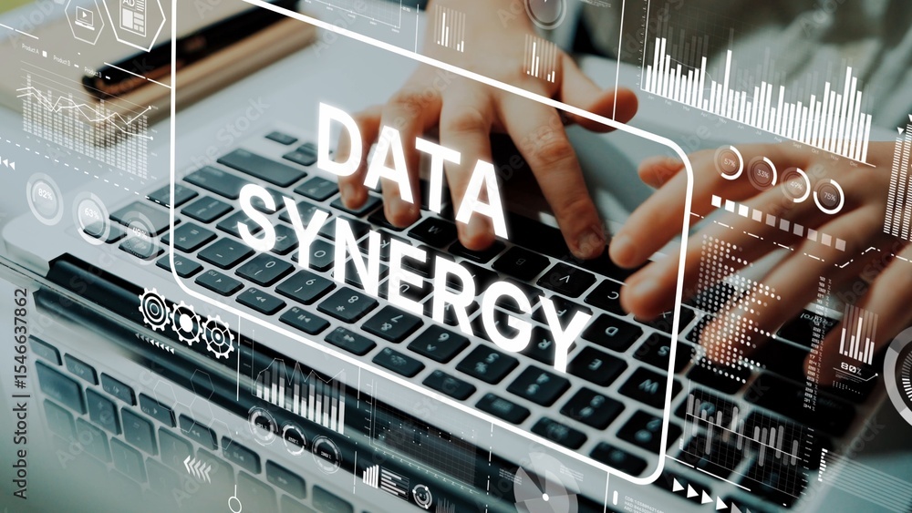 Poster hands typing on laptop keyboard with data synergy concept graphic overlaid in a modern workspace env
