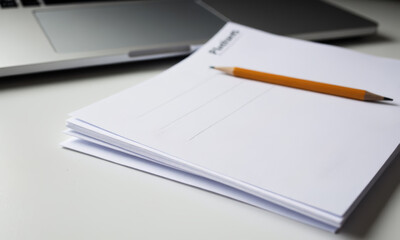 A Stack of Blank Scorecards and a Pencil on a Table