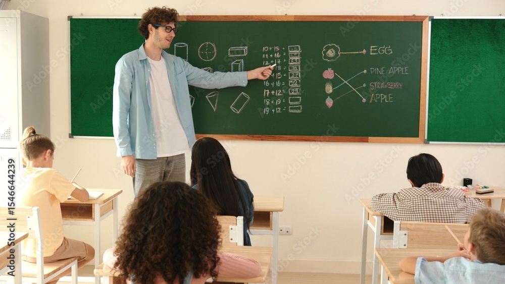 Poster skilled teacher walking at classroom while looking at student homework. professional instructor chec