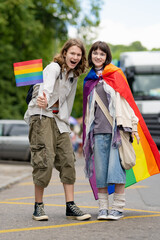 Obraz premium Happy cheerful teenagers participating in Vilnius Pride 2024 parade, that took place in Vilnius Old Town.