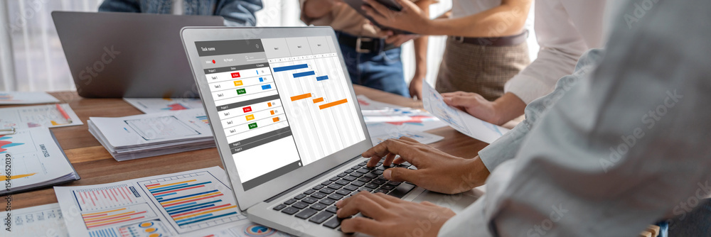 Fototapete Project planning software for brisk business project management on the computer screen showing timeline chart of the team project