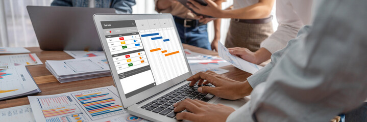 Project planning software for brisk business project management on the computer screen showing...