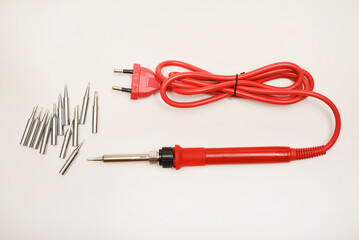Shiny soldering iron tips. A red soldering iron with nickel-plated stingers.