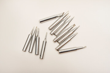 Shiny soldering iron tips. Electric soldering iron tip on a white background.