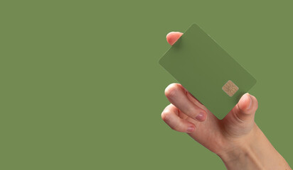 Card and currency concept. Female customer holding bankcard in hand, payment or transfer, retail