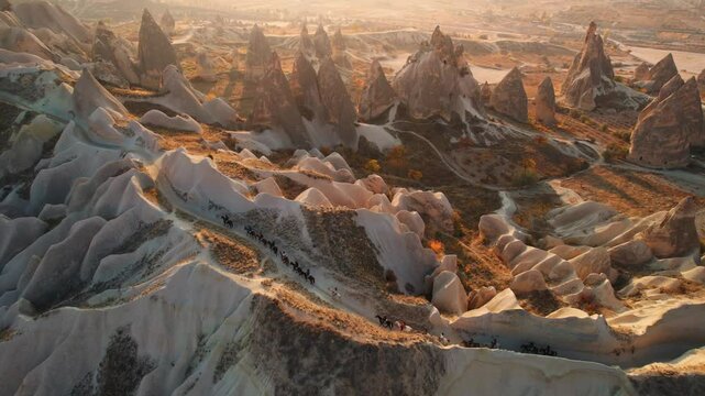 Aerial view Landscape sunset in Cappadocia, travel tour excursion on horse in Goreme Turkey.