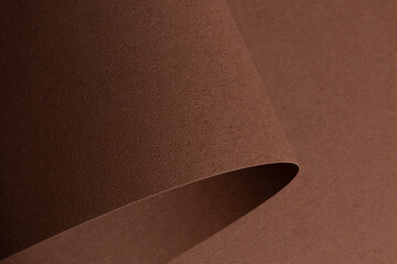 Elegant designer paper background in chocolate brown coffee tones with pitted porous texture and