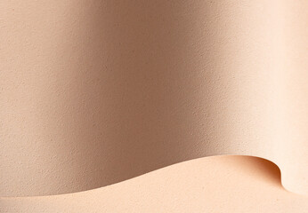 Elegant designer paper in beige and cream tones with rough grained texture and pierced surface.