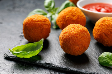 Arancini Rice Balls. Crispy, deep fried rice balls stuffed with mozzarella cheese