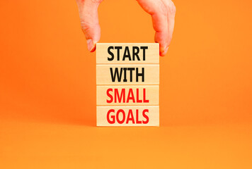 Start with small goals symbol. Concept words phrase Start with small goals on beautiful wooden...