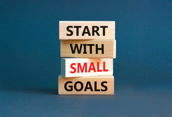 Start with small goals symbol. Concept words phrase Start with small goals on beautiful wooden...