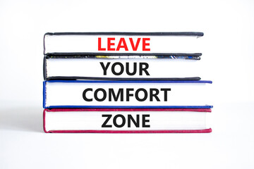 Leave your comfort zone symbol. Concept words Leave your comfort zone on beautiful books. Beautiful white paper background. Business psychological Leave your comfort zone concept. Copy space.