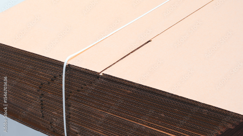 Poster Brown cardboard sheets is neatly placed in a stack for further use as background for template pages and banners delivery logistics concept