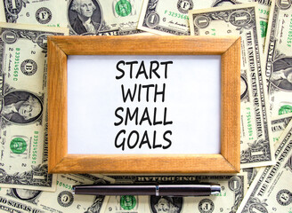 Start with small goals symbol. Concept words phrase Start with small goals on beautiful white note....