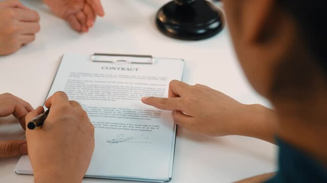 Couples legal file for divorcing by assistance from law firm to divide property after breakup. Obligations contract assist by lawyer in negotiating settlement agreement meeting. Slow motion. Rigid.