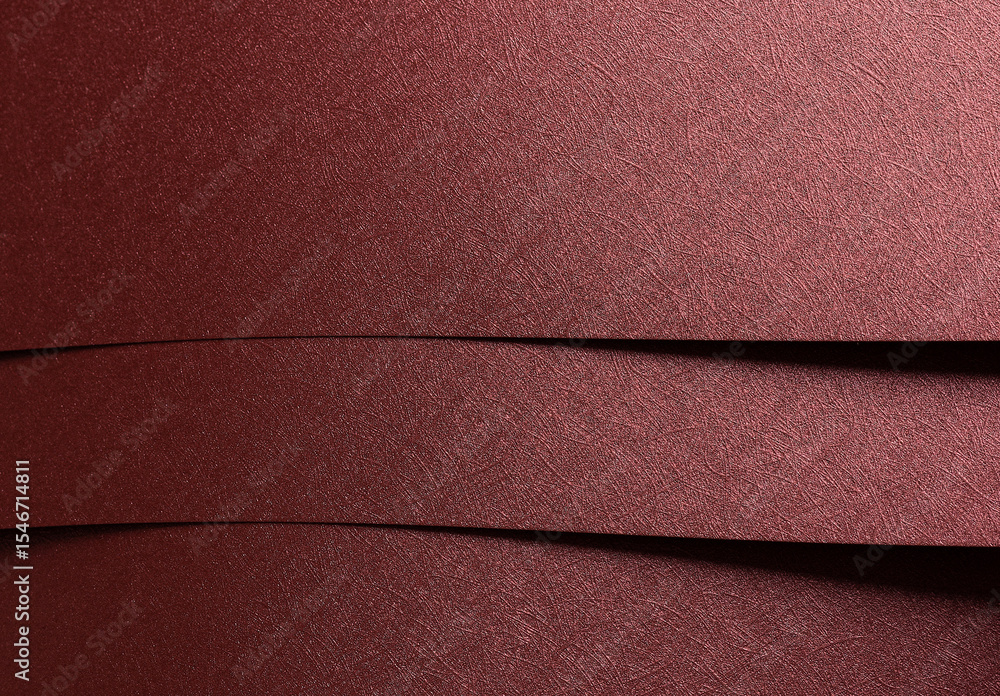 Poster paper background closeup. red and marsala metallic sheets with geometric overlap, shiny gloss,