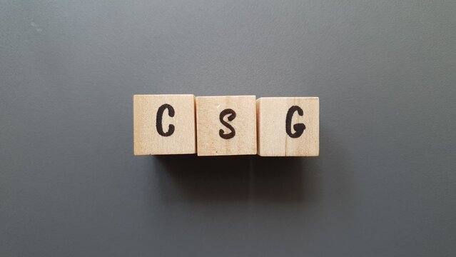 CSG acronym made of wooden letter cubes on dark background. Contribution Sociale G&eacute;n&eacute;ralis&eacute;e (General Social Contribution, a tax funding social security)