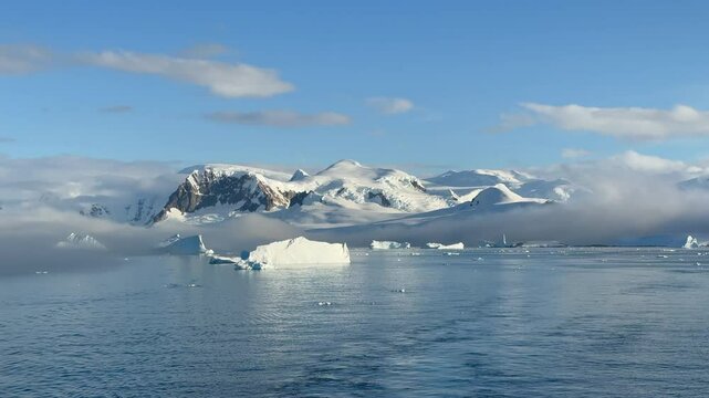Big Iceberg in Antarctica Winter Scenery, Amazing Shape Ice Formation of Massive Large Enormous Blue Icebergs in Antarctic Peninsula Landscape Seascape with Ocean Sea Water