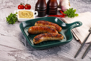 Delicous natural roasted sausages in the plate