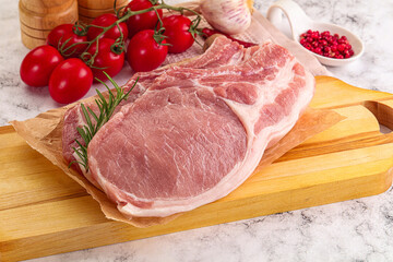 Raw potk loin steak with bone