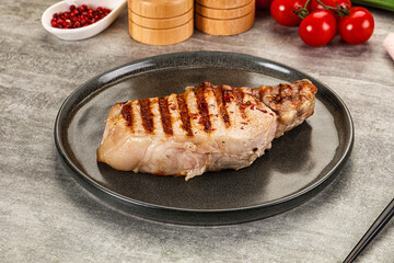 Grilled pork loin steak with bone