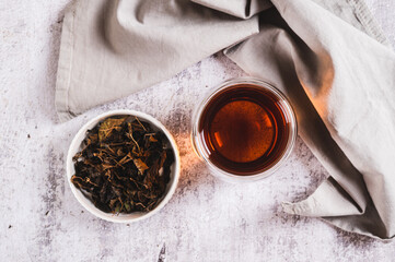 Close up of Earl Grey tea with bergamot in a cup on table top view