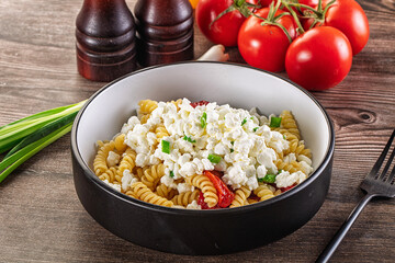 Italian pasta fusili with curd