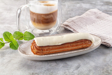White vanilla eclair with icing