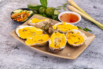Baked oyster with cheddar cheese
