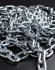Fototapeta premium Silver color chain link on black background.