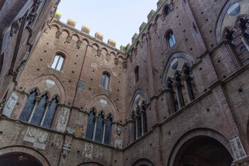 Fototapeta premium Traditional Medieval Courtyard in Italy, Low-angle Shot, Courtyard of the Podestà, Siena, Tuscany, Italy