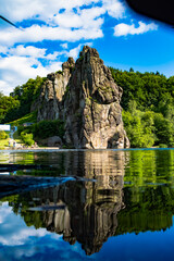 Fototapeta premium Vertical Reflection of Externsteine in Calm Lake, Germany