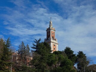 Historic tower amidst nature under blue sky. Madrid view. Spain