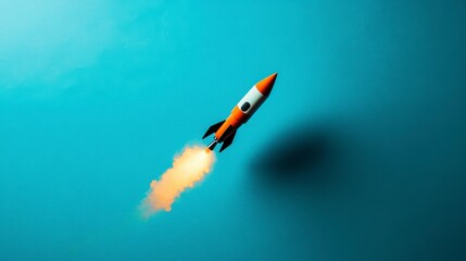 Orange and black toy rocket launching against a blue background.