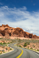 Winding road through spectacular landscape scenery in the Arches National Park in Moab. No people. Travel concept.