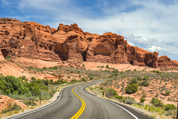 Winding road through spectacular landscape scenery in the Arches National Park in Moab. No people.