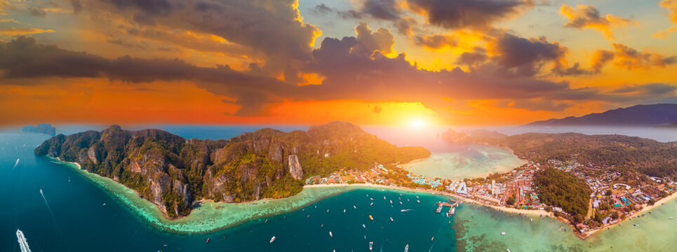 Panoramic aerial view tonsai bay koh Phi Phi Don island Krabi Thailand Bay magical paradise islands with rocks on coast of coral reef atoll in Andaman Sea from drone above sunset