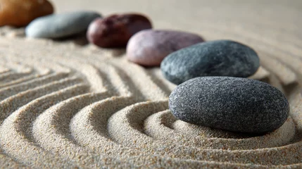 Photo sur Plexiglas Zen-inspired pattern of smooth stones arranged in sand to symbolize calm and harmony