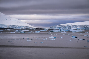 Beautiful paradise harbor in Antarctica under overcast sky