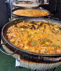 Authentic Spanish Paella Cooking in Large Cast Iron Pan