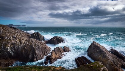 rocky coast atlantic ocean in cloudy weather with sea water waves and foam nature