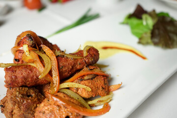 Delicious Indian Tandoori Chicken Tikka Masala with Onions and Peppers