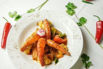 Spicy Prawn Curry Dish with Peppers and Cilantro Garnish